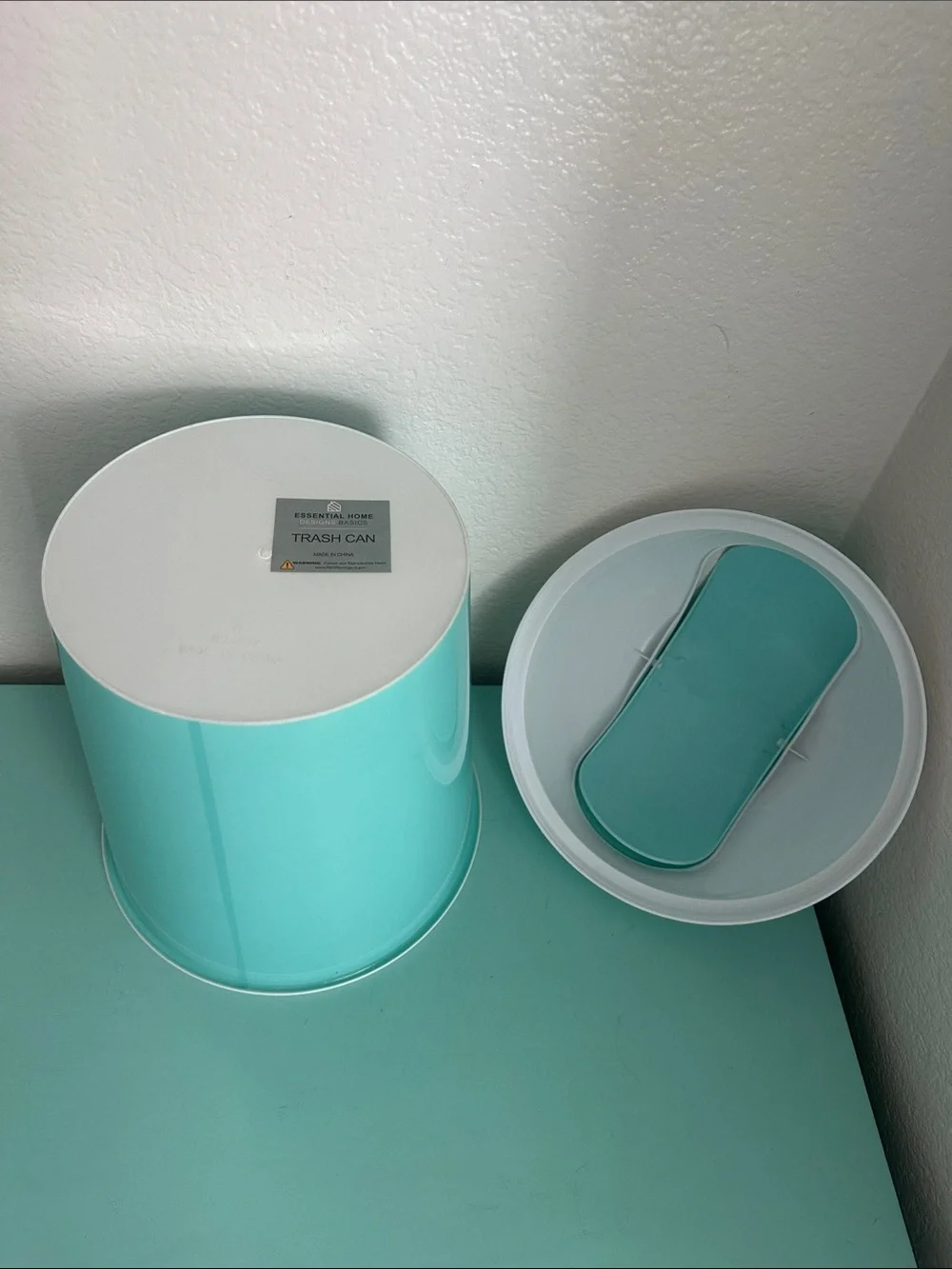 Essential Home Designs-basic plastic trash can with swinging top-new